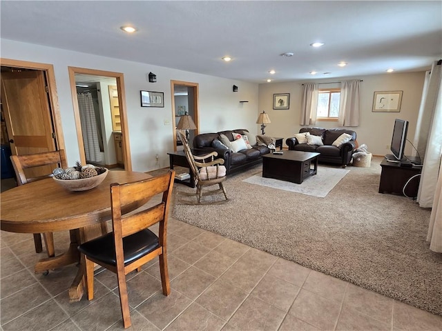 living room with light tile patterned flooring, light colored carpet, and recessed lighting