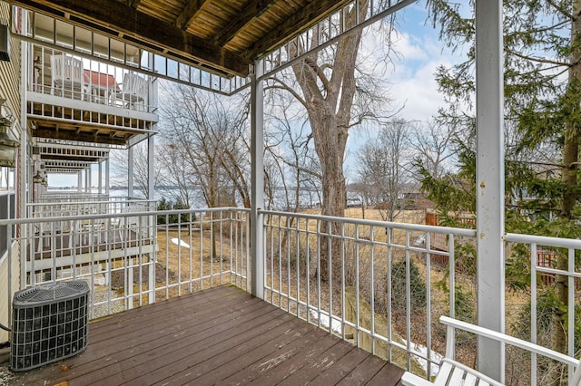 wooden terrace featuring cooling unit