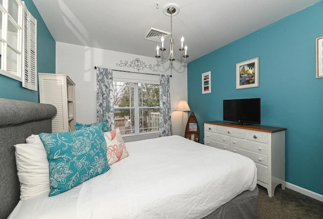 bedroom with baseboards, carpet flooring, visible vents, and a notable chandelier