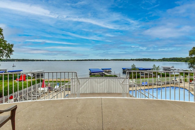 exterior space featuring a water view and a floating dock