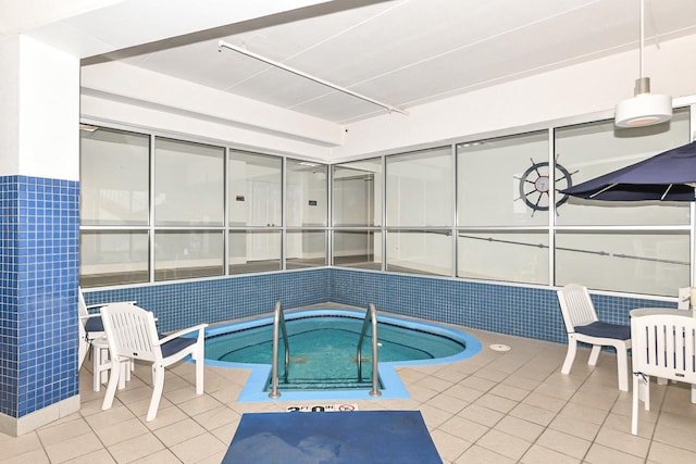 view of swimming pool featuring an indoor in ground hot tub