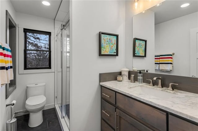 bathroom with tile patterned flooring, toilet, recessed lighting, vanity, and a shower stall