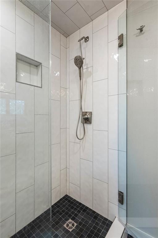 bathroom with a shower stall