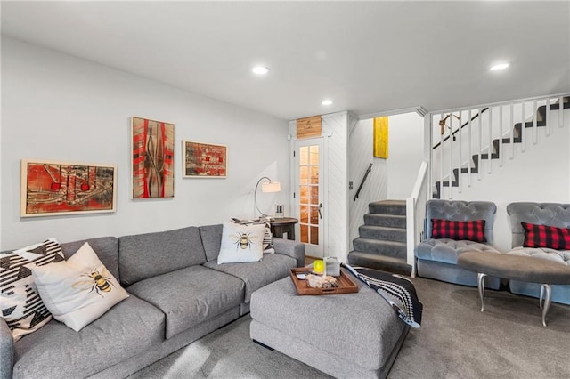 carpeted living room with stairs and recessed lighting