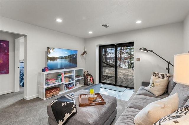 carpeted living area with baseboards, visible vents, and recessed lighting