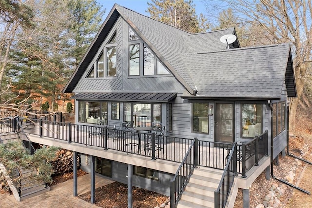 back of house featuring stairs, metal roof, a shingled roof, and a wooden deck