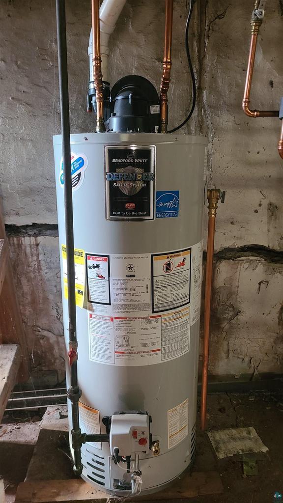 utility room with gas water heater