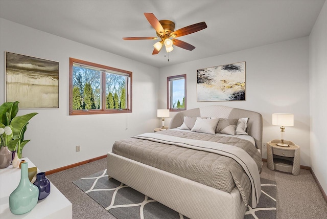 bedroom featuring carpet floors, a ceiling fan, and baseboards