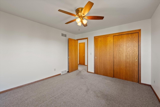 unfurnished bedroom featuring a closet, visible vents, and baseboards