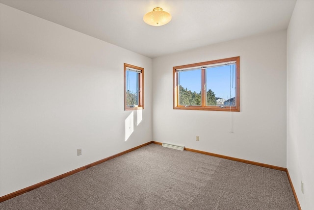 carpeted empty room with visible vents and baseboards