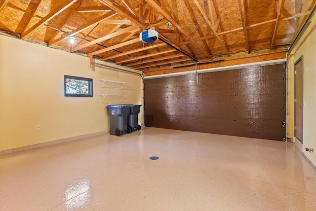 garage featuring baseboards and a garage door opener