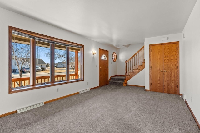 interior space with a baseboard radiator, visible vents, stairway, and baseboards