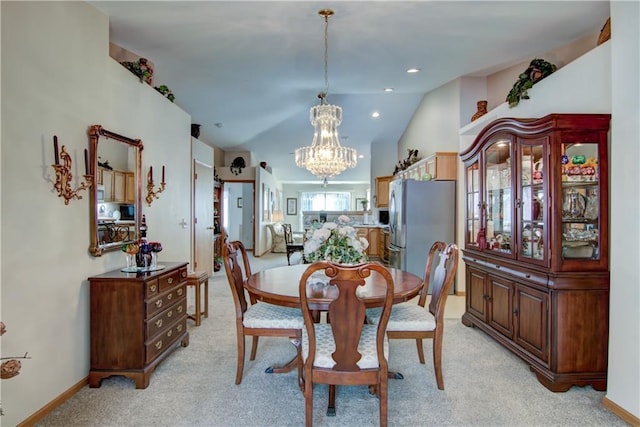 dining room with lofted ceiling, a chandelier, recessed lighting, light carpet, and baseboards