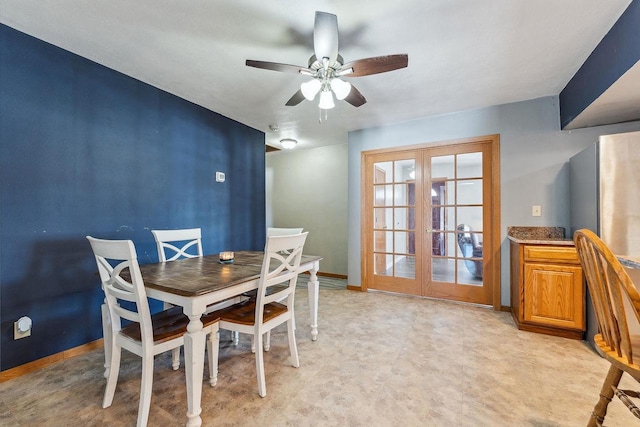 dining room featuring french doors, ceiling fan, and baseboards