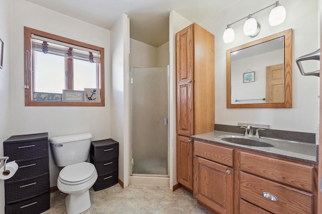 full bathroom with toilet, a stall shower, and vanity