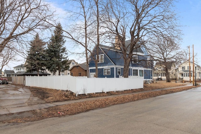 exterior space featuring sidewalks and a residential view