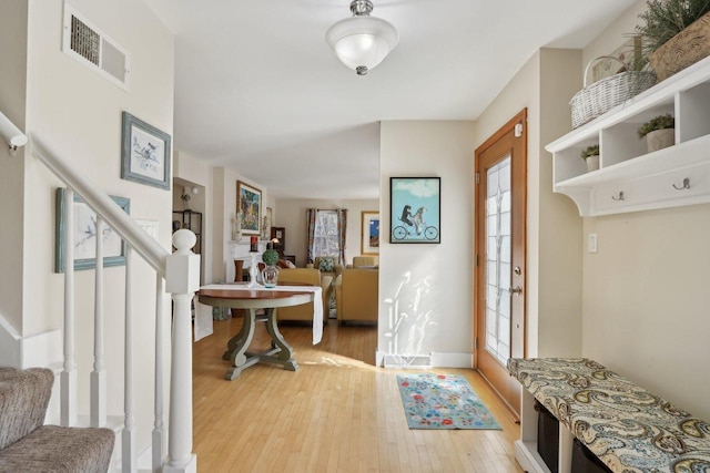 interior space featuring a wealth of natural light, visible vents, and stairs