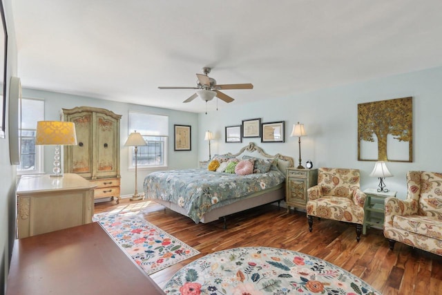 bedroom with ceiling fan and wood finished floors