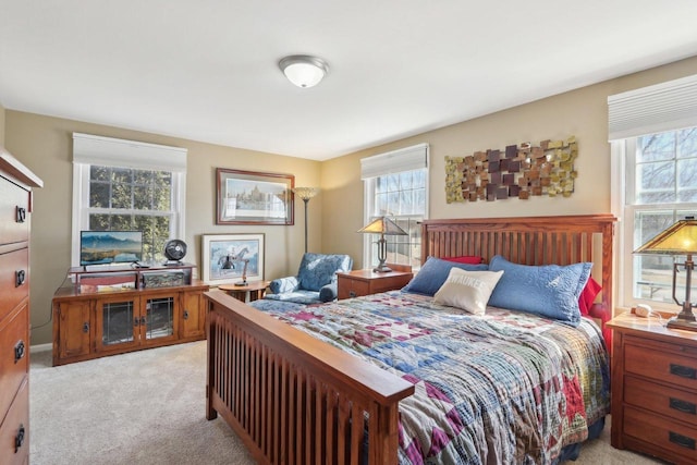 bedroom featuring light carpet