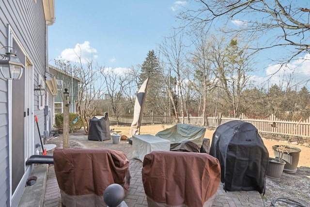 view of patio with a fenced backyard and grilling area