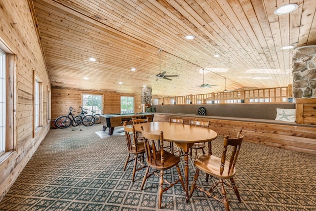 dining space with recessed lighting, wood ceiling, carpet flooring, wood walls, and high vaulted ceiling