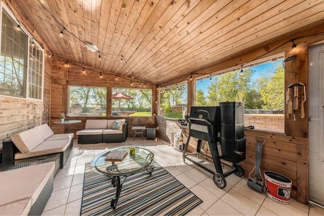 sunroom with lofted ceiling and wooden ceiling