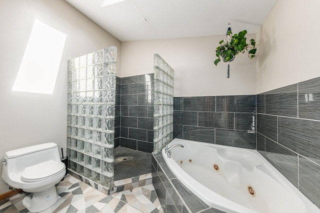 bathroom with tiled shower, a whirlpool tub, and toilet