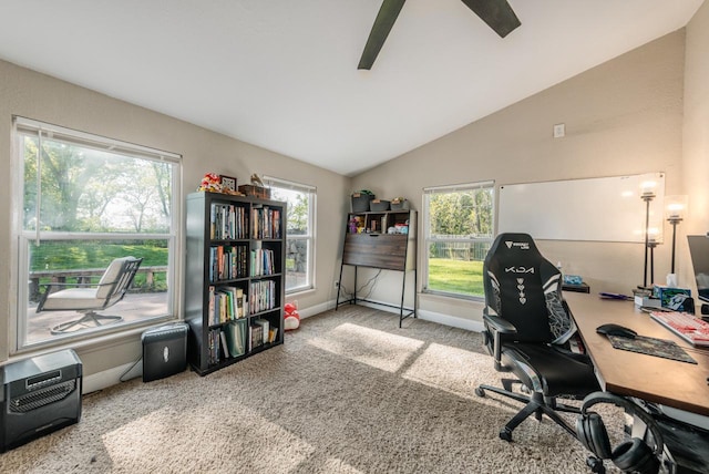 carpeted home office featuring vaulted ceiling, plenty of natural light, and heating unit