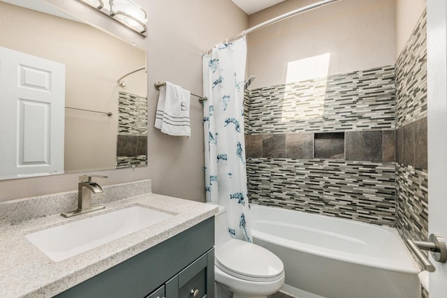 bathroom featuring shower / tub combo, vanity, and toilet