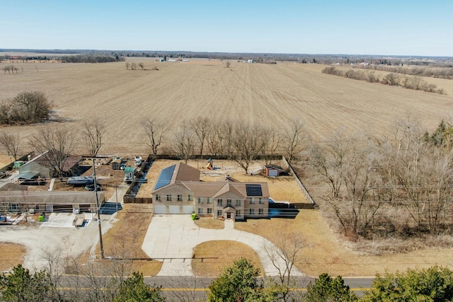 birds eye view of property with a rural view