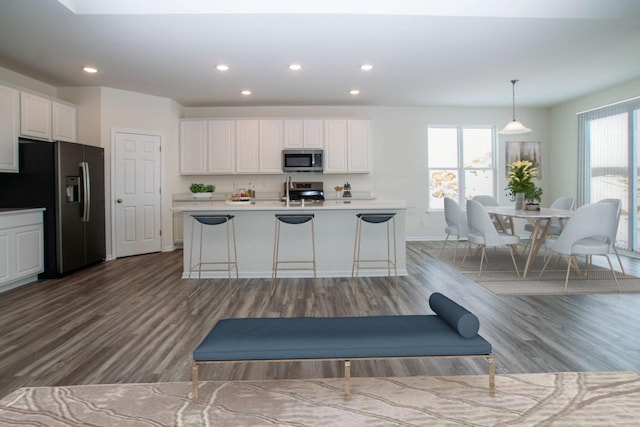 kitchen featuring appliances with stainless steel finishes, recessed lighting, and white cabinetry