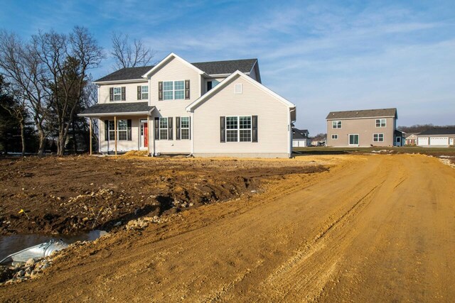 408 Canterbury Ct Unit Lt151Jackson, Williams Bay, WI 53191 - view of front of home featuring dirt driveway