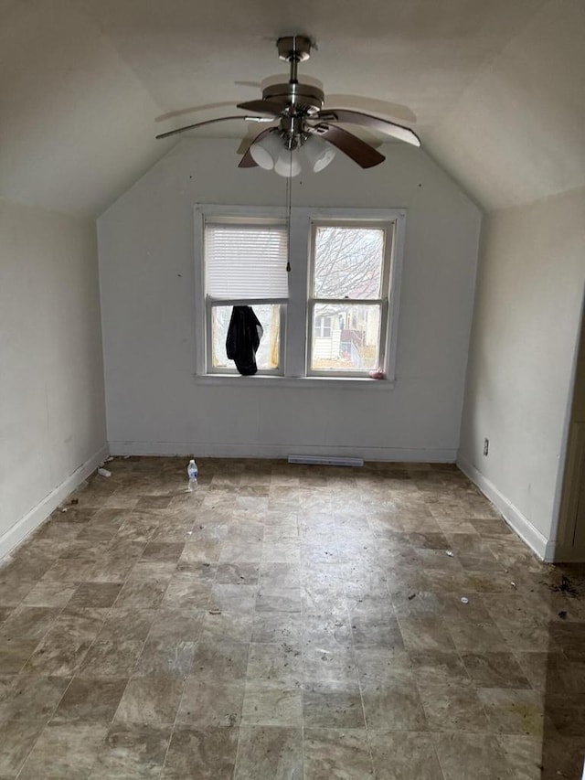 additional living space featuring lofted ceiling, ceiling fan, and baseboards