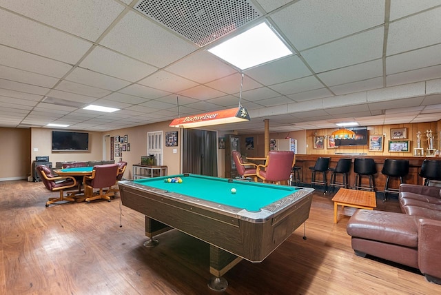 rec room with visible vents, a bar, wood finished floors, and pool table