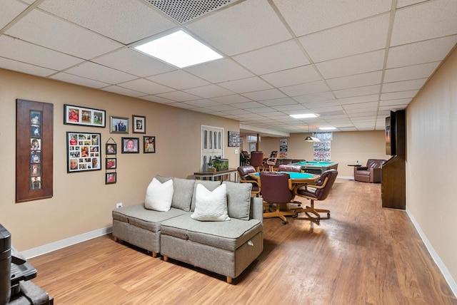 living area with light wood-type flooring, baseboards, and billiards