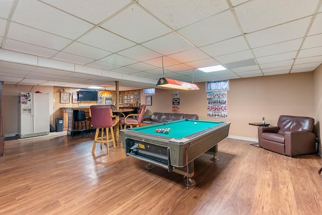 rec room with pool table, baseboards, a drop ceiling, a dry bar, and wood finished floors