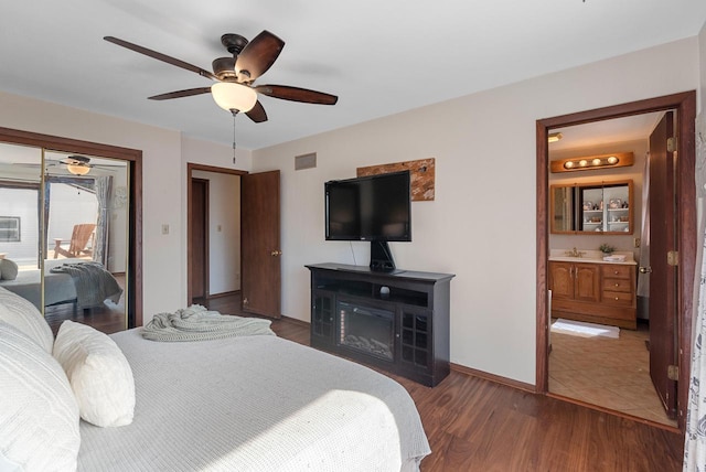 bedroom with a ceiling fan, wood finished floors, visible vents, baseboards, and access to exterior