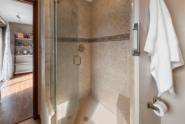 bathroom with a shower stall