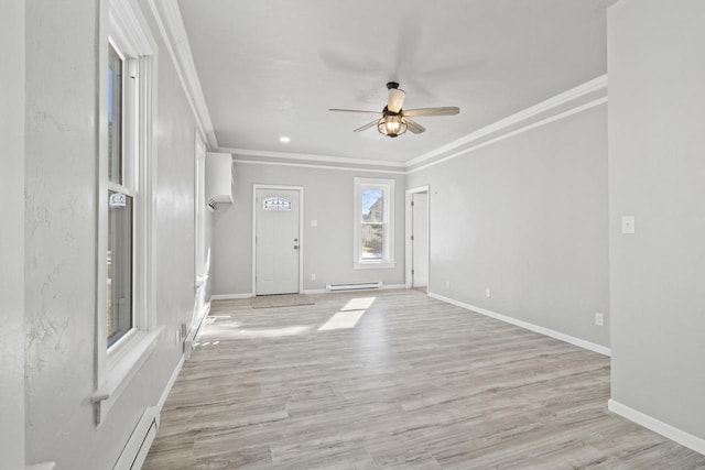 interior space with ornamental molding and baseboards