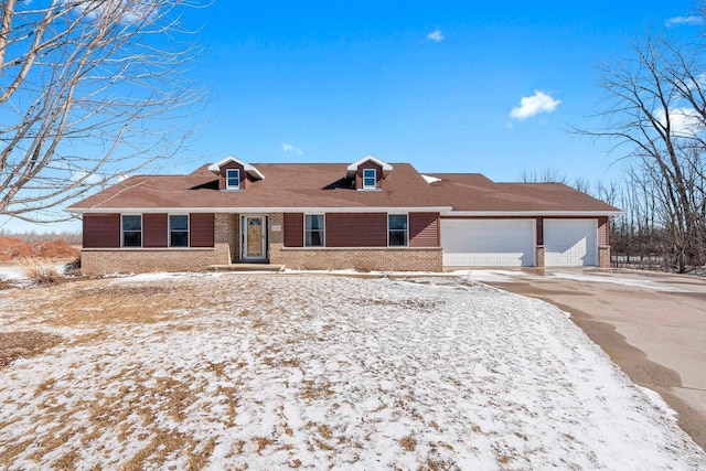 view of front of house with a garage and brick siding