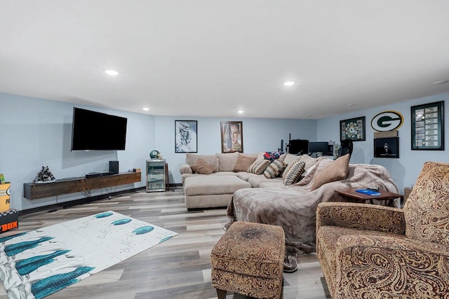 living room with wood finished floors and recessed lighting