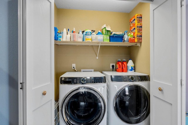 washroom with laundry area and washing machine and dryer