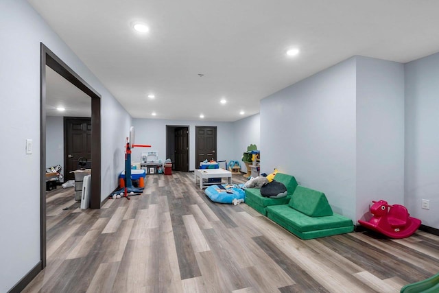 rec room featuring wood finished floors and recessed lighting