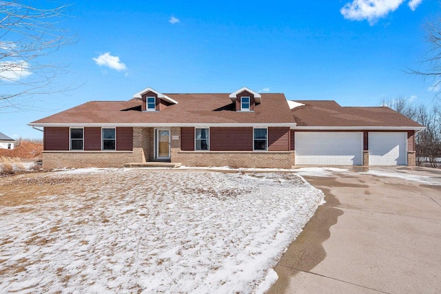 ranch-style home featuring a garage, concrete driveway, and brick siding