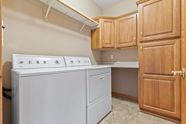 laundry room featuring cabinet space and separate washer and dryer