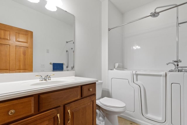 bathroom with toilet and vanity