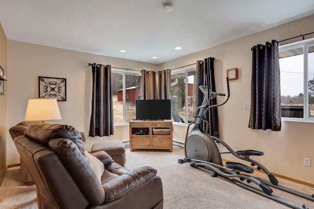 exercise room featuring a baseboard radiator, recessed lighting, carpet flooring, baseboards, and baseboard heating