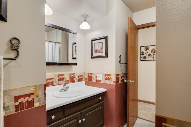 bathroom with vanity and baseboards