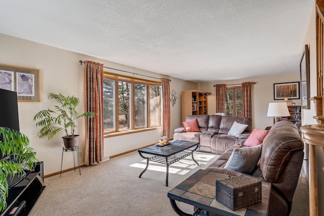 carpeted living room featuring a textured ceiling and baseboards