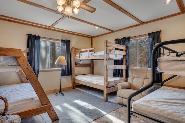 bedroom featuring carpet floors, baseboards, and beam ceiling